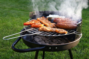 Sausage and meat on grill