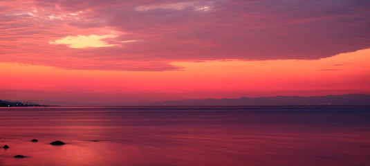 Fototapeta na wymiar Pink Sunrise By The Seaside