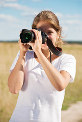 girl taking photo with camera