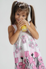 cute girl drinking orange juice