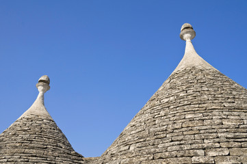Fototapeta na wymiar Trulli. Conical roofs. Alberobello. Apulia.