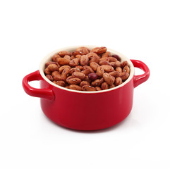 fagioli borlotti in cocotte su fondo bianco