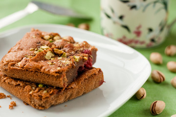 Chocolate cake with raspberries and pistachio