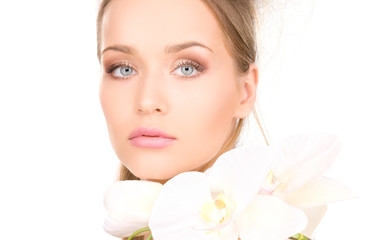 Fototapeta premium beautiful woman with white flower