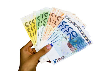 Euro banknotes isolated on a white background.