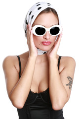 Naklejka premium Portrait of the beautiful girl in sunglasses