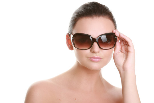 Portrait of a beautiful young woman in sun glasses