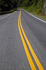 scenic country road curves through Shenandoah  National Park.
