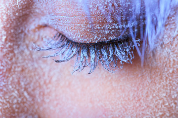 Frozen woman's eye covered in frost