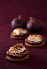 figs and cheese on cracker