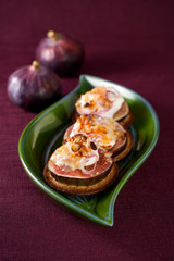 figs and cheese on cracker