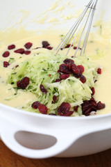 Making zucchini bread with cranberries