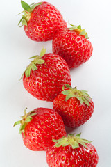Ripe strawberry on white background
