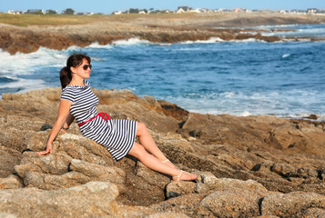Fototapeta na wymiar young lady at the ocean coast