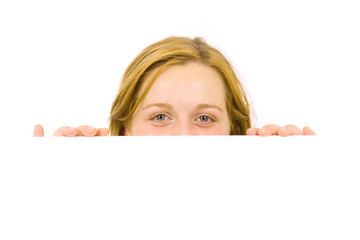 Fototapeta premium Portrait of a beautiful blond woman holding a blank billboard