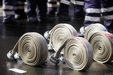 rolled up hoses, prepared for a fire fighter competition