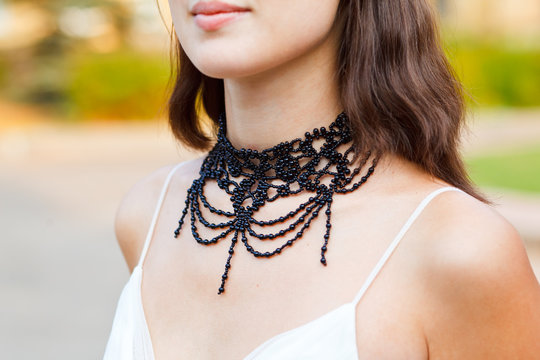 beautiful adornment on neck of young woman