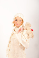 Happy winter girl in hat and gloves smiling