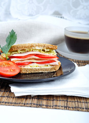 fresh and delicious classic club sandwich with coffee