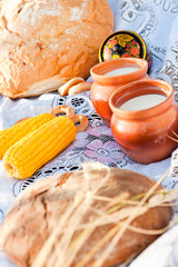 milk jug, corn and bread