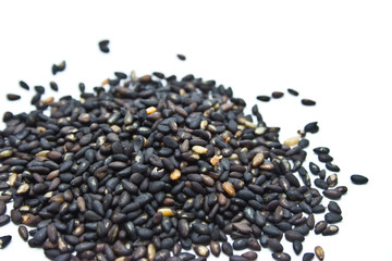 Black sesame seeds isolated on white background