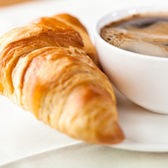 Croissant and a cup of delicious coffee