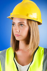 Young girl with hard hat against background