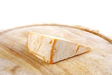 light swiss cheese on wood