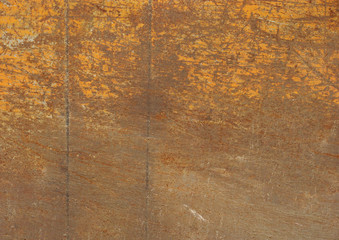 orange painted metal with rust and scratches