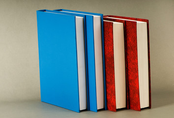 Stack of books on the color background
