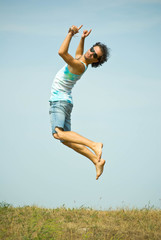 man jumping on sky background