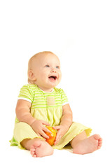 Young little baby eat red peach on white
