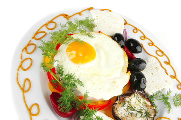 egg on white plate with vegetables