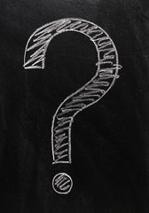 Question mark drawn in chalk on a blackboard