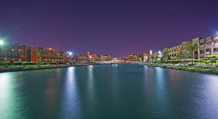 Fototapeta na wymiar View of a hotel lagoon at night