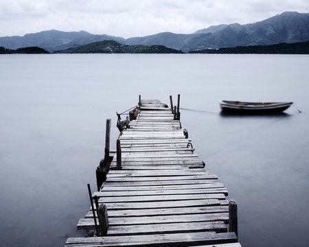 Fototapeta look on pier and boat, low saturation
