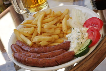 Fried sausages with potatoes