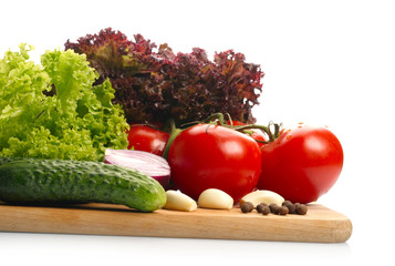 Fresh vegetables on wooden hardboard
