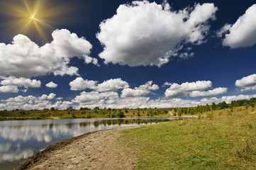 Fototapeta na wymiar Wonderful view lake and autumnal meadow.