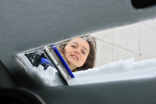 Winter Time - Person Cleaning Car