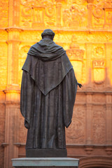 Naklejka premium Statue and twilight on Salamanca cathedral