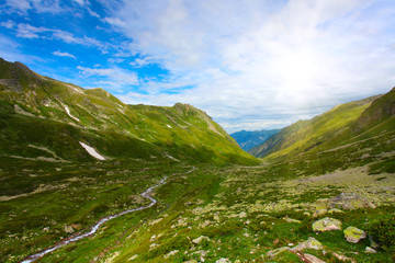 Green field and white clouds