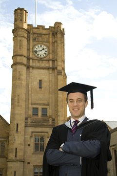 A potrait of a young European guy in a graduation gown.