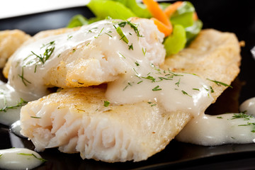 Fish dish - fried fish fillet with vegetables