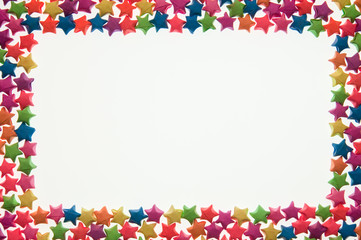 Star made from paper arranged in a frame picture shape