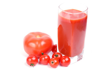 Tomatoes and juice on a white background
