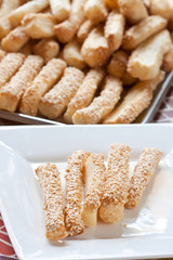 Pastry cakes with sesame on plate.