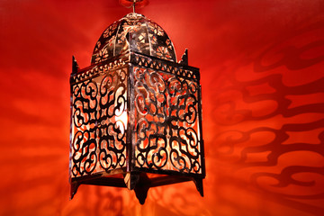 Stylish arabic lantern in colorful background