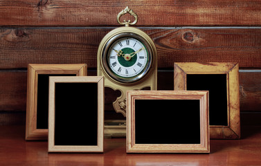 old photo frames and antique clock