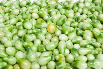 A background of fresh vine green tomatoes